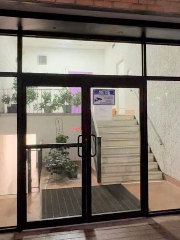 Storefront with newly fitted black-framed glass